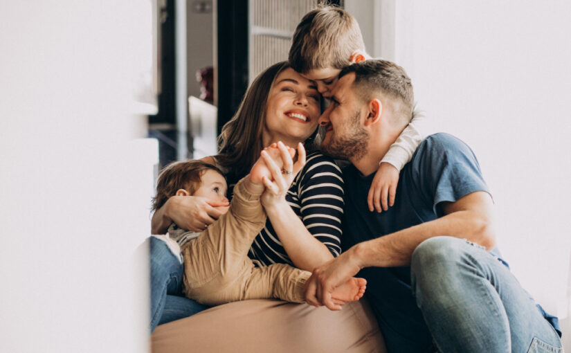 Alt= young-family-with-their-sons-home-having-fun
